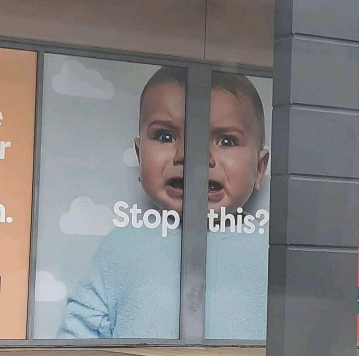 a billboard of a baby, cut in half. It says " Stop This?"