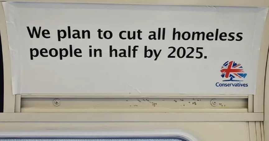 A bilboard that says "We plan to cut all homeless people in half by 2025"